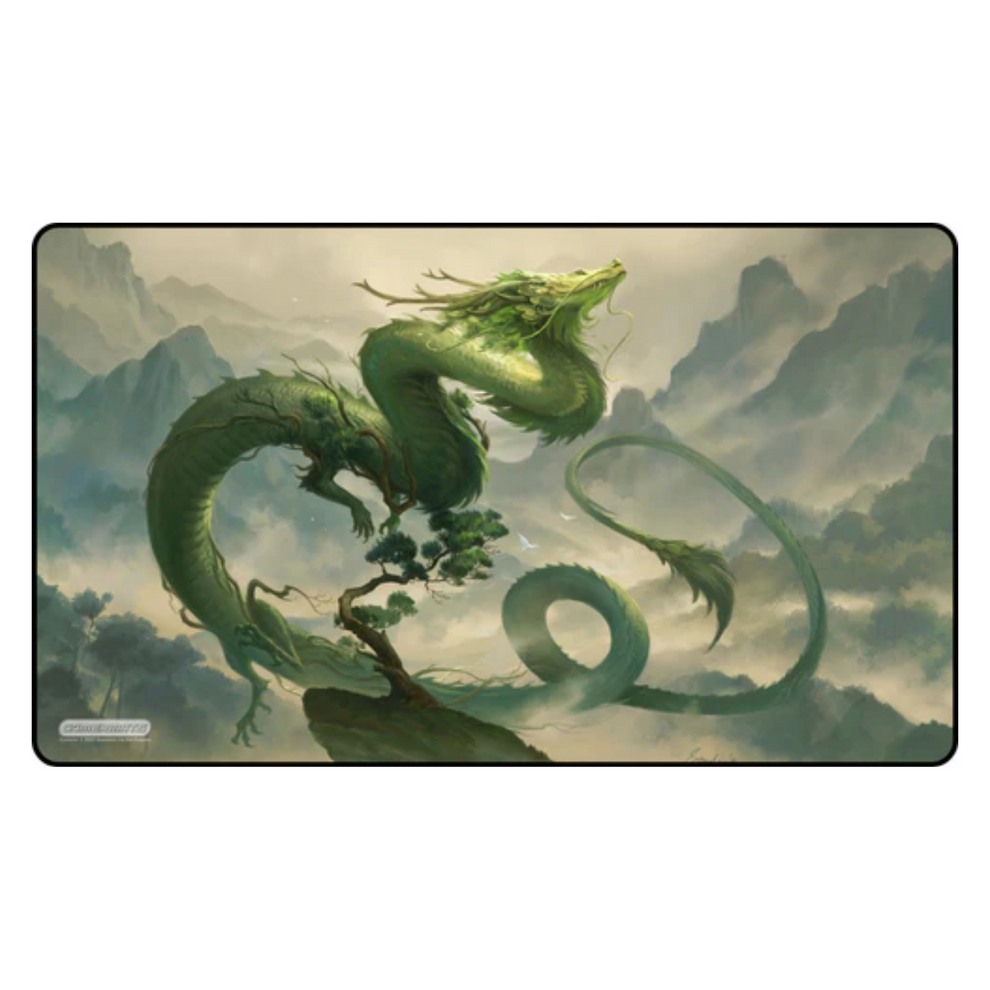 Dragon bonsai design on a playmat with a mountain and cloud background