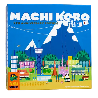 Board game box for 'Machi Koro' with colorful illustration of a town on a white background