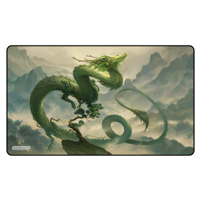 Dragon bonsai design on a playmat with a mountain and cloud background